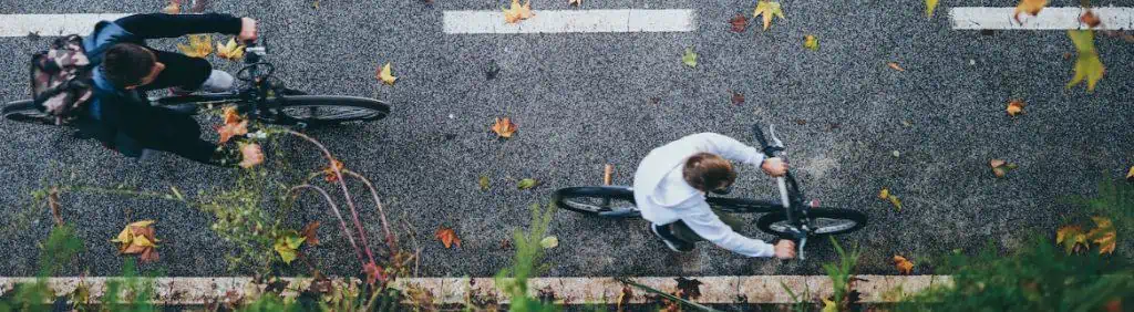 Two guys cycling on the road. 
